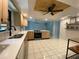 Bright kitchen featuring updated appliances, quartz countertops, and a unique ceiling design at 170 Lady Susan Ct, Casselberry, FL 32707