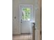 Bright laundry room with view to the backyard, a windowed door, and included washer at 170 Lady Susan Ct, Casselberry, FL 32707