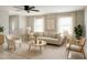 Bright living room with neutral color palette, comfortable seating, natural light, and a ceiling fan at 170 Lady Susan Ct, Casselberry, FL 32707