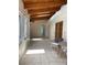 Bright sunroom featuring light-colored tile floors, exposed wood beams, and an outdoor seating area at 170 Lady Susan Ct, Casselberry, FL 32707