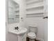 Functional half bathroom with storage shelves and a white sink at 1704 15Th St, Orange City, FL 32763