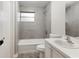 Well-lit bathroom featuring a shower-over-tub combination and vanity with sink at 1704 15Th St, Orange City, FL 32763
