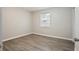 Cozy bedroom featuring wood-look flooring and a window at 1704 15Th St, Orange City, FL 32763