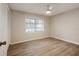 Cozy bedroom featuring wood-look flooring, a ceiling fan, and a closet at 1704 15Th St, Orange City, FL 32763