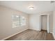 Cozy bedroom featuring wood-look flooring, a window, and a closet at 1704 15Th St, Orange City, FL 32763