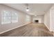 Expansive living room featuring wood-look flooring and a fireplace at 1704 15Th St, Orange City, FL 32763