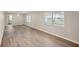 Spacious living room with attractive wood-look flooring and plenty of natural light at 1704 15Th St, Orange City, FL 32763