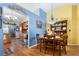 Charming dining area with hardwood floors, adjacent to an updated kitchen at 1969 La Rue Ave, Deltona, FL 32725