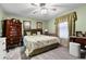 Relaxing main bedroom featuring neutral colored walls, ceiling fan, and a bright window at 1969 La Rue Ave, Deltona, FL 32725