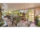 Enclosed sunroom with plenty of seating, foliage and natural light at 1969 La Rue Ave, Deltona, FL 32725