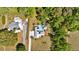 Aerial shot revealing a home with a pool, set within a verdant and private backyard at 245 Country Circle E Dr, Port Orange, FL 32128