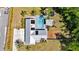 Aerial view of backyard oasis with in-ground pool, deck, and trampoline at 245 Country Circle E Dr, Port Orange, FL 32128