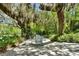 Secluded backyard patio with shade from large oak trees at 245 Country Circle E Dr, Port Orange, FL 32128