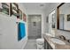 A remodeled bathroom features tile floors, a walk-in shower, and a granite countertop sink at 245 Country Circle E Dr, Port Orange, FL 32128