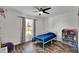 A cozy bedroom features wood floors and natural light from the window at 245 Country Circle E Dr, Port Orange, FL 32128