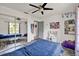 A cozy bedroom features hardwood floors, closet, and play area at 245 Country Circle E Dr, Port Orange, FL 32128