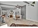 Dining area showcases stone accent wall, ceiling beams, and decorative shelving with a piano at 245 Country Circle E Dr, Port Orange, FL 32128