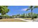 Exterior view showing a well-maintained property with a black fence and lush landscaping at 245 Country Circle E Dr, Port Orange, FL 32128