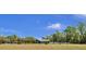 Exterior view showing a well-maintained property with a black fence and lush landscaping at 245 Country Circle E Dr, Port Orange, FL 32128
