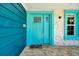 Close-up of the bright blue front door with stylish details and hardware at 245 Country Circle E Dr, Port Orange, FL 32128