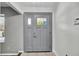 Charming entryway with a gray front door featuring decorative glass inserts at 245 Country Circle E Dr, Port Orange, FL 32128