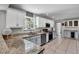 Modern kitchen with stainless steel appliances, granite countertops, and ample cabinet space at 245 Country Circle E Dr, Port Orange, FL 32128