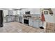 Well-equipped kitchen featuring stainless steel appliances and ample counter space at 245 Country Circle E Dr, Port Orange, FL 32128
