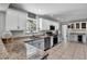 Well-lit kitchen boasts granite countertops, stainless steel appliances, and ample cabinet space at 245 Country Circle E Dr, Port Orange, FL 32128