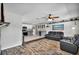 Open concept design integrates living and kitchen areas, with hardwood floors and modern decor at 245 Country Circle E Dr, Port Orange, FL 32128