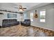 Comfortable living room with hardwood flooring and plenty of natural light at 245 Country Circle E Dr, Port Orange, FL 32128