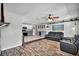 Bright living space with kitchen and dining room featuring tile and wood floors at 245 Country Circle E Dr, Port Orange, FL 32128