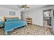 Spacious main bedroom with wood-look floors and a view leading to a walk-in closet and the bathroom at 245 Country Circle E Dr, Port Orange, FL 32128