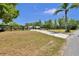 Wide view of a rural property with a fenced yard and a long driveway at 245 Country Circle E Dr, Port Orange, FL 32128