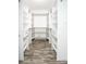 A walk-in closet is maximized by custom shelving and storage at 245 Country Circle E Dr, Port Orange, FL 32128