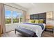 Bright bedroom with a large window offering ample natural light and stylish decor at 2608 Roadster Ln, Kissimmee, FL 34746