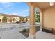 Exterior view from the covered entrance, showing well-kept complex buildings and parking area at 2608 Roadster Ln, Kissimmee, FL 34746