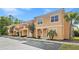 Inviting townhouse complex with well-maintained exteriors, multiple units, and convenient parking spaces at 2608 Roadster Ln, Kissimmee, FL 34746