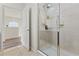 Shower with sliding glass door and tile surround at 2608 Roadster Ln, Kissimmee, FL 34746