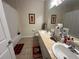 Functional bathroom with a tub/shower combination and double vanity sinks at 2964 Lucayan Harbour Circ # 106, Kissimmee, FL 34746