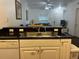 Modern kitchen with stainless steel sink, granite countertops, and ample white cabinet space at 2964 Lucayan Harbour Circ # 106, Kissimmee, FL 34746
