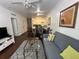 Open-concept living area flowing into the dining space and kitchen at 2964 Lucayan Harbour Circ # 106, Kissimmee, FL 34746