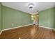 Hardwood floor bedroom with open access to the bathroom and walk-in closet at 3012 S Semoran Blvd # 3, Orlando, FL 32822