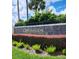 Elegant entrance sign for the Wimbledon Condominium Community with manicured landscaping and lush greenery at 3012 S Semoran Blvd # 3, Orlando, FL 32822