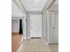 Bright entryway with neutral paint, tile floors, coat closet, and access to the living area at 3012 S Semoran Blvd # 3, Orlando, FL 32822