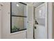 Convenient laundry area with a stacked washer and dryer next to a bright window at 3012 S Semoran Blvd # 3, Orlando, FL 32822