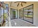 Screened patio with ceiling fan and sliding door to an interior space at 3012 S Semoran Blvd # 3, Orlando, FL 32822