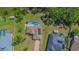 Aerial view of a beautiful property featuring a private pool, spacious yard, and lovely landscaping at 3394 Hawkin Dr, Kissimmee, FL 34746