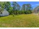 Large backyard area with shed and view of the screened-in pool area at 3394 Hawkin Dr, Kissimmee, FL 34746