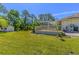 Spacious backyard featuring a shed and manicured lawn at 3394 Hawkin Dr, Kissimmee, FL 34746