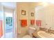 Bathroom featuring neutral color and tile and with access to the pool area at 3394 Hawkin Dr, Kissimmee, FL 34746